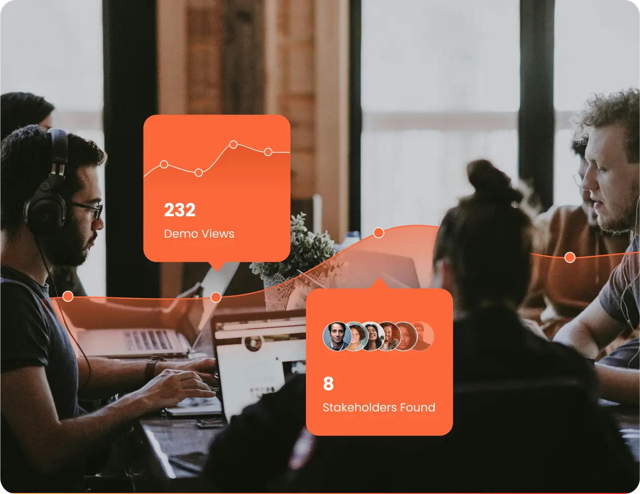 Four people work on laptops at a table, collaborating on a marketing project. Overlay graphics highlight "232 Demo Views" with a line chart and "8 Stakeholders Found," creating a sense of FOMO for those not yet involved. Consensus
