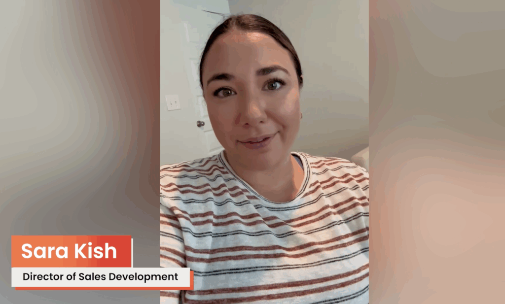 A woman with dark hair in a striped shirt looks at the camera, ready to share Startup Demo insights. A label reads “Sara Kish, Director of Sales Development” in the lower left corner. Consensus