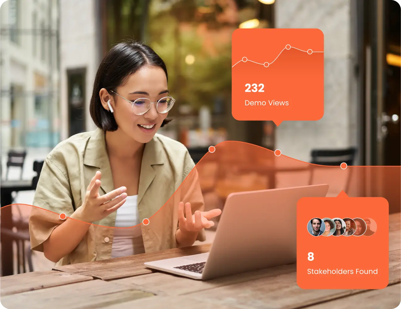 A woman wearing glasses and earbuds sits at an outdoor table, speaking while looking at her laptop. Overlay graphics display "232 Demo Views" and "8 Stakeholders Found." It appears she's participating in a session from Consensus Academy.